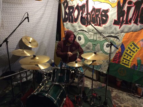Wes Kime playing drums during brothers KIME studio recording session