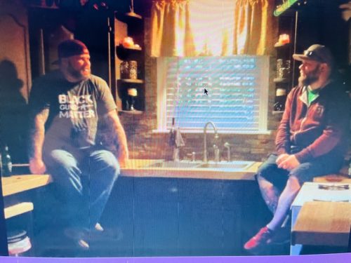 Behind-the-scenes moment with Ran Kime and Wes Kime of brothers KIME, capturing downtime, conversation, and the bond behind the music.
