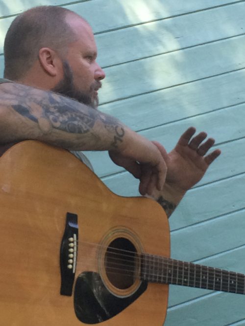 Ran Kime of brothers KIME talking songwriting and ideas with an acoustic guitar in hand, blending everyday life with the band’s creative process.