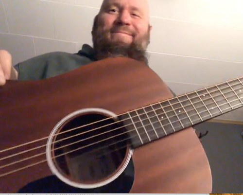 Wes Kime of brothers KIME captured in a candid guitar selfie, offering a personal glimpse into the band’s creative downtime.