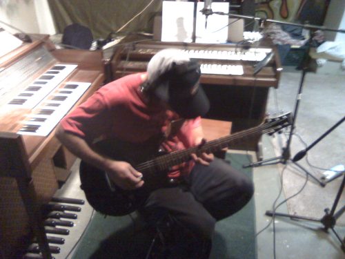 Wes Kime of Brothers KIME playing electric guitar during a recording session at Winter Hill Studios, capturing the raw, hands-on creative process.