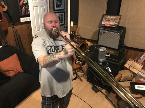 Wes Kime performing trombone during a Winter Hill Studios session, showcasing Brothers KIME’s multi-instrumental recording style.