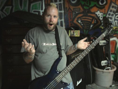 Wes Kime of Brothers KIME with a mohawk, captured in a candid studio moment that reflects the band’s humor and personality.